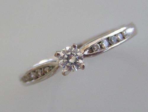 9 CARAT WHITE GOLD AND DIAMOND ENGAGEMENT RING