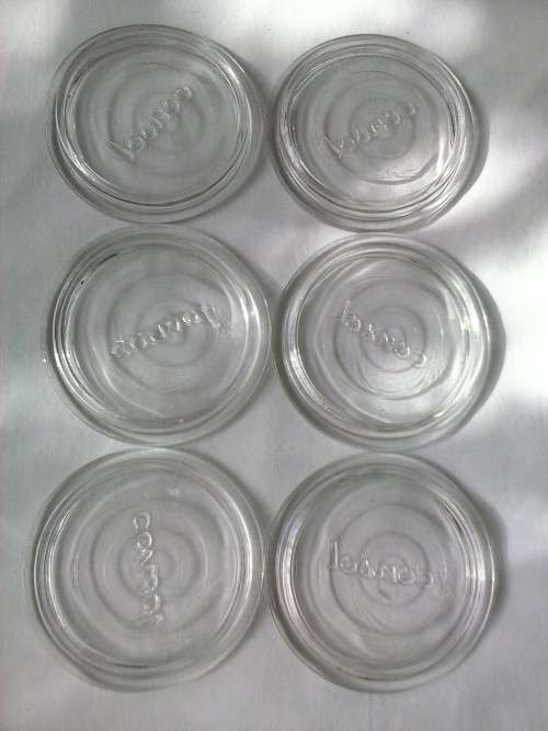 Six glass lids for Consol preserve jars
