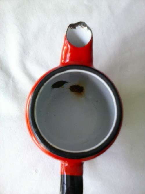 Enamel jug, red with black trim