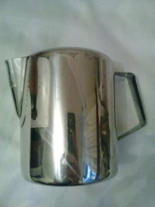 Stainless steel water jug, holds 750ml. Excellent condition. 12 cm high, 9cm dimeter.