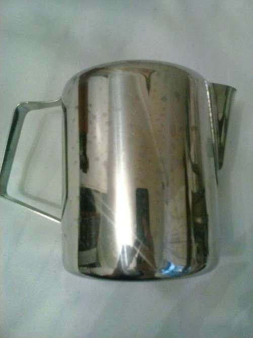 Stainless steel water jug, holds 750ml. Excellent condition. 12 cm high, 9cm dimeter.