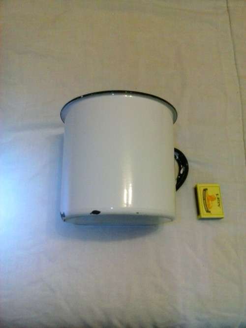 Large enamel jug, slightly damaged, white with black trim, 14.5cm high x 16cm diameter