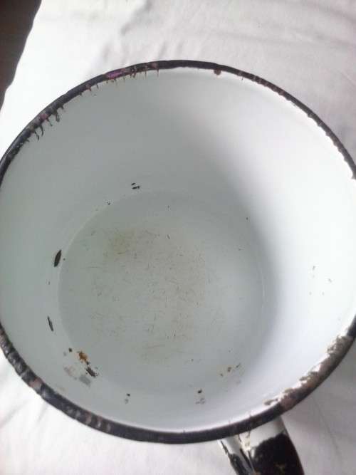 Large enamel jug, slightly damaged, white with black trim, 14.5cm high x 16cm diameter