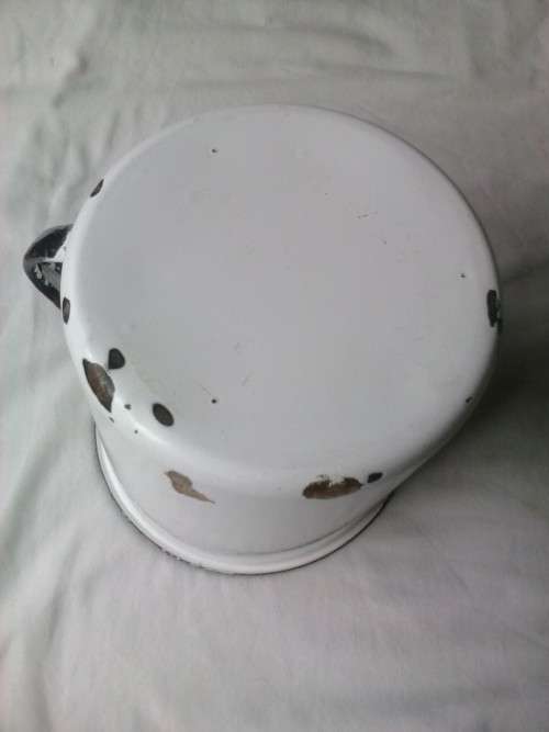 Large enamel jug, slightly damaged, white with black trim, 14.5cm high x 16cm diameter