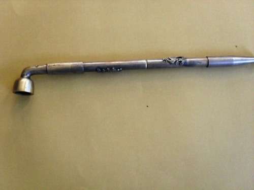 Chinese opium pipe, pewter with intricate dragon carvings