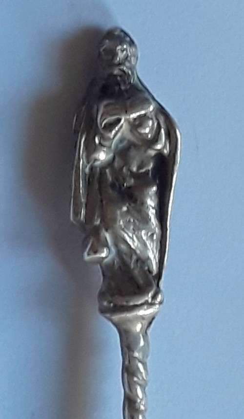 An antique solid silver spoon with figural finial. Arthur Graf, London, 1911.