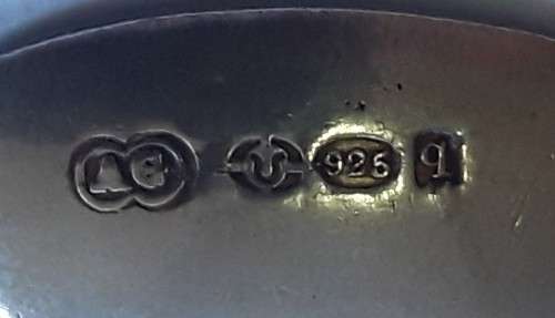 An antique solid silver spoon with figural finial. Arthur Graf, London, 1911.