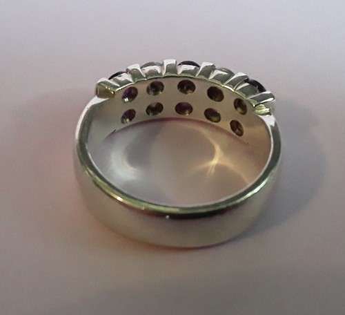 Lovely solid sterling silver ring with clear and purple stones.