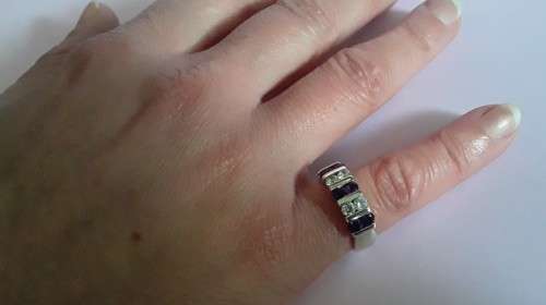 Lovely solid sterling silver ring with clear and purple stones.