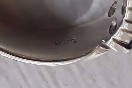 Lovely solid sterling silver ring with clear and purple stones.