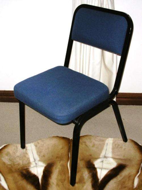 Office Chair. Black metal frame with blue upholstery.
