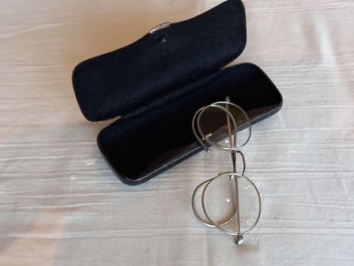 Antique pair of Granny glasses in metal frame, with black metal box.