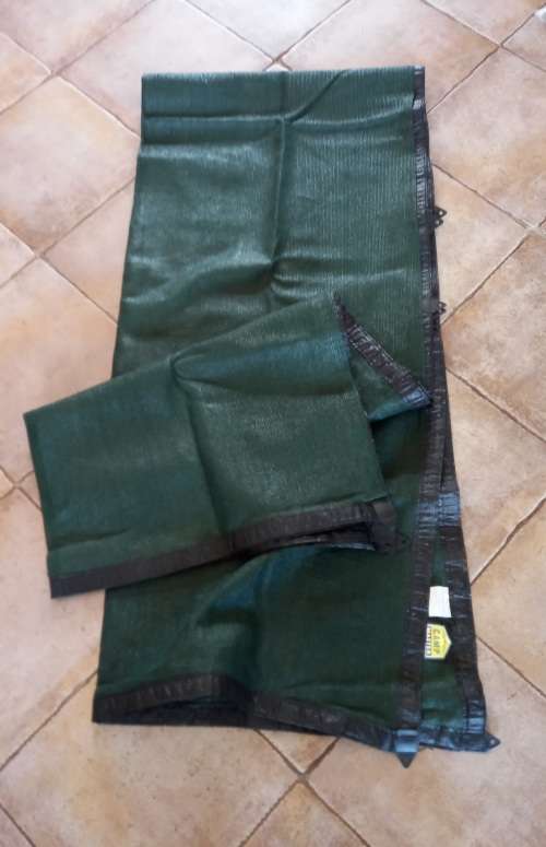 Camp Master green netted ground sheet for camping/caravan.