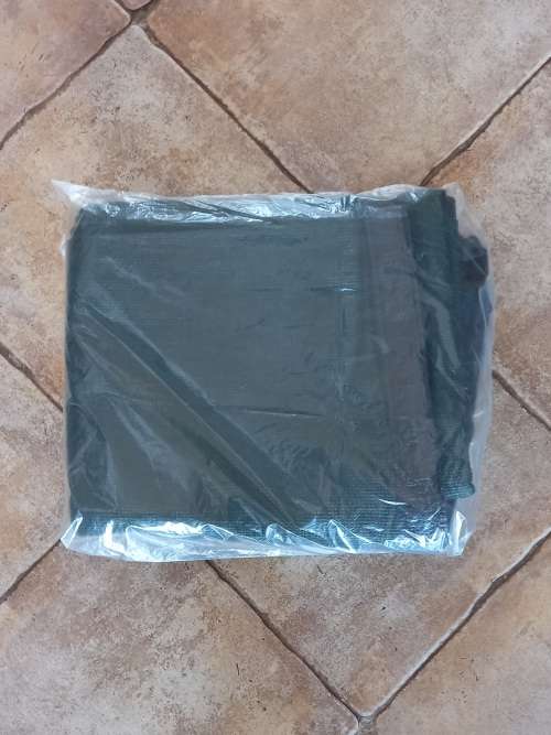 Camp Master green netted ground sheet for camping/caravan.