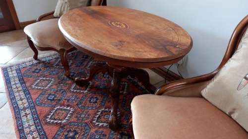Antique Salon table oval, with solid carved wooden legs.