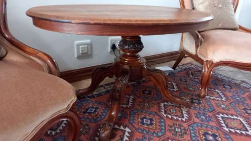 Antique Salon table oval, with solid carved wooden legs.
