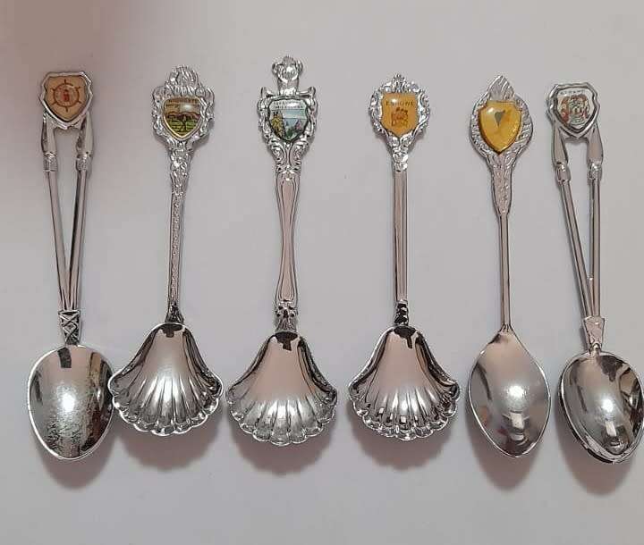 Vintage collectable spoons on wall stand