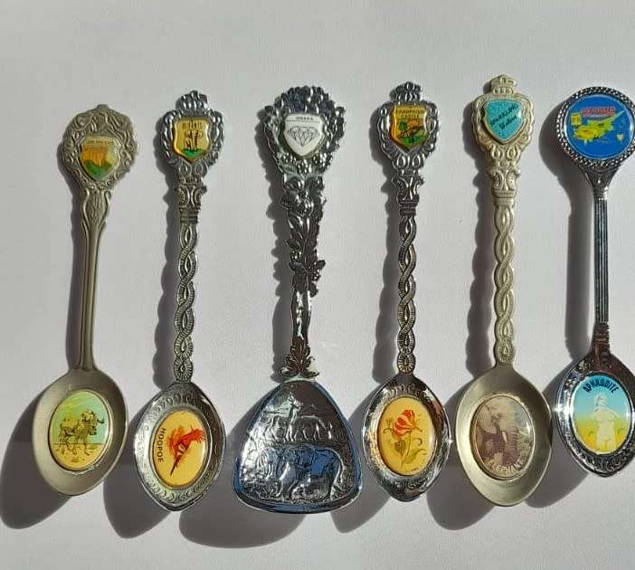 Vintage collectable spoons on wall stand