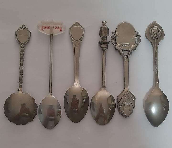 Vintage  collectable spoons on wall stand