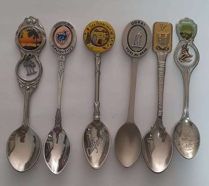 Vintage  collectable spoons on wall stand