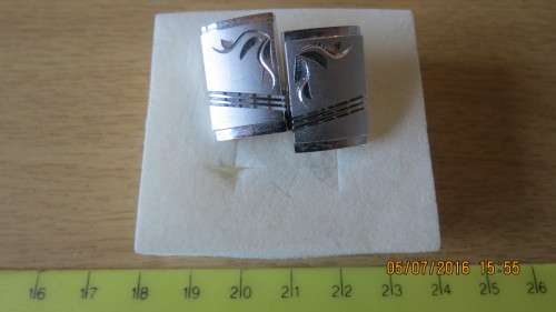 set of men's cufflinks, as per photo