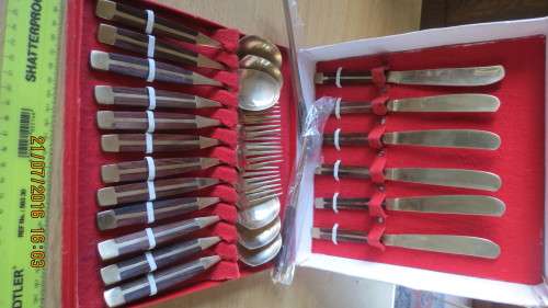 set of 6 knives, folks and spoons in box and 4 skewers,1 large ladle,salt and pepper, as per photo