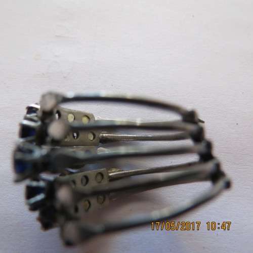 Blue and yellow stone multi ring (5 rings connected at bottom), one blue stone missing, as per photo