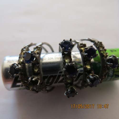 Blue and yellow stone multi ring (5 rings connected at bottom), one blue stone missing, as per photo