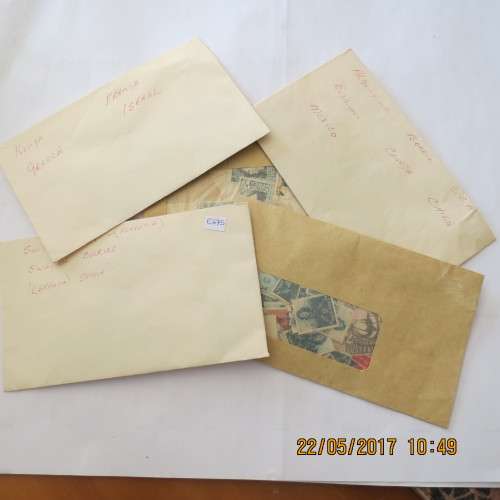 5 envelopes with stamps in them, as per photo
