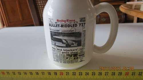 porcelain beer mug, by Crescent ware, with various newspaper printed on it, as per photo