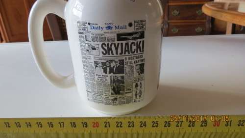 porcelain beer mug, by Crescent ware, with various newspaper printed on it, as per photo