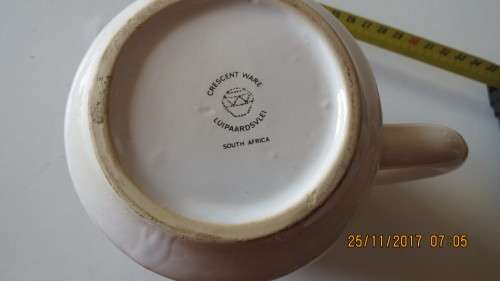 porcelain beer mug, by Crescent ware, with various newspaper printed on it, as per photo