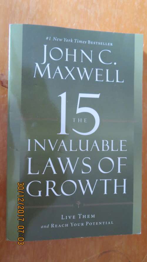 The 15 Invaluable Laws of Growth by John C. Maxwell, as per photo