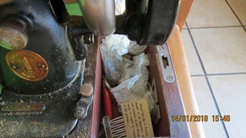 Singer sewing machine in box with accessories, as per photo