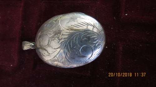 silver engraved locket, 11.7 grams, 4.5cm by 3cm, as per photo
