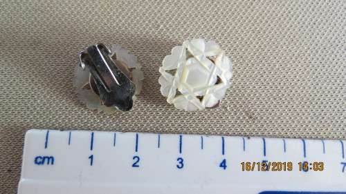 pair of mother of pearl earrings, clip on with the star of David, as per photo