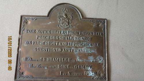 brass plaque with take notice that as from todays date poachers shall be shot., as per photo