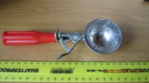 Ice cream scoop, plastic handle, looks like its been replaced, as per photo