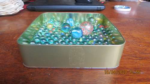 tin of old marbles and goons, 149 marbles and 5 goons, as per photo