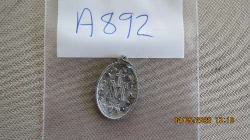 very old St Christopher medal, made from aluminium, on reverse a cross with the letter M,  as per ph