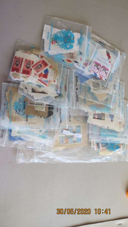 Mixed bag of stamps, semi sorted, as per photo
