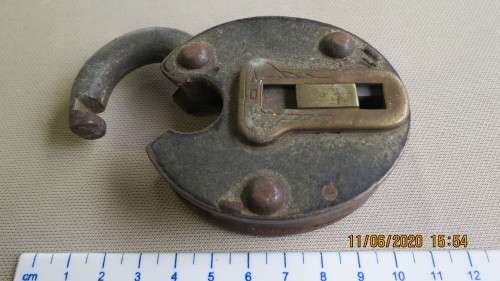 antique lock, no key, does not clip in, sold as is, as per photo
