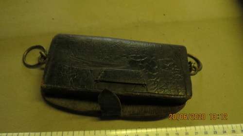 old leather pouch, 15cm long, brass loops on side, can see where badge came off, as per photo
