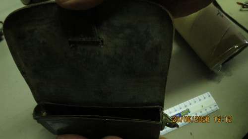 old leather pouch, 15cm long, brass loops on side, can see where badge came off, as per photo