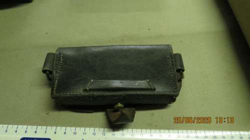 old leather pouch, 15.5cm long, loops on side, can see where badge came off, as per photo