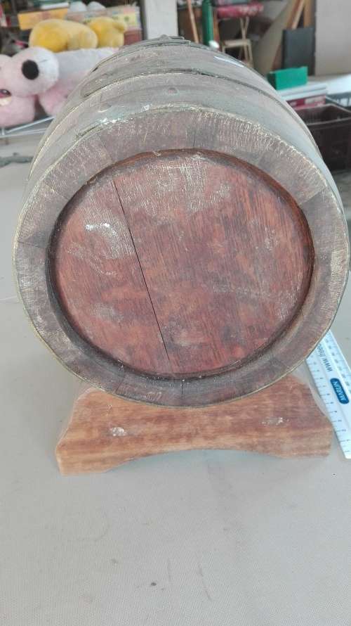 old oak barrel with brass tap on stand,barrel 23cm long, 17.5cm diameter,plug missing,as per photo