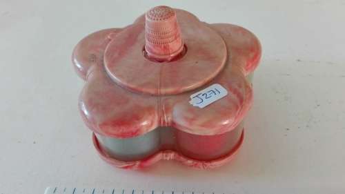 very attractive container with cottons and thimble on the top, as per photo