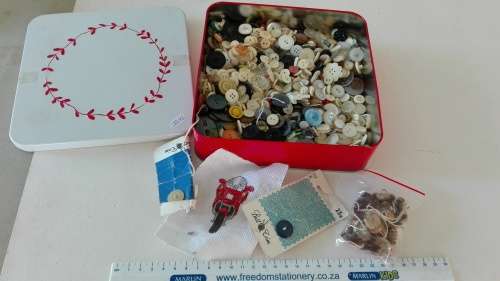 tin of buttons, 19cm by 19cm and 4,5cm deep, as per photo