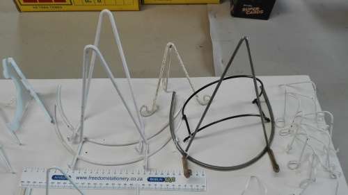 box of plate stands, 29, some are chipped and peeling, and four plate hangers, as per photos