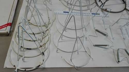 box of plate stands, 29, some are chipped and peeling, and four plate hangers, as per photos